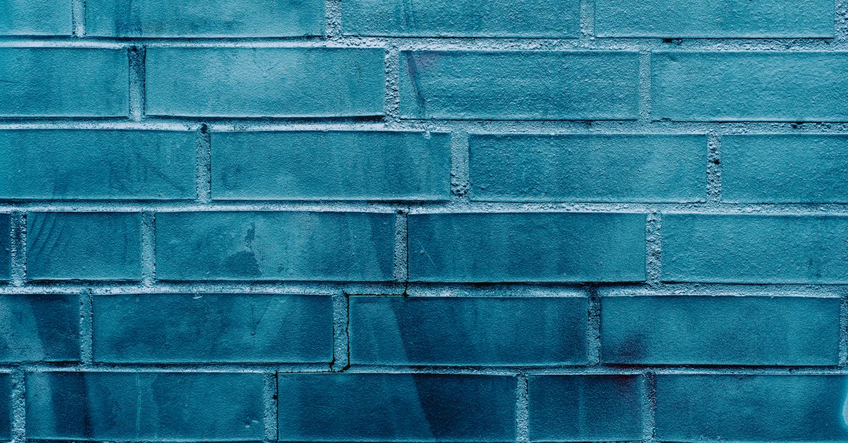 Blue Brick Wall with Subtle Graffiti Texture · Free Stock Photo