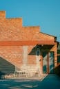 Modern Urban Rooftop Patio with Brick Wall
