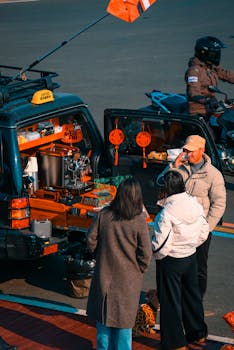 People gather around a mobile coffee shop on a sunny day.