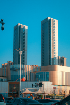 High-rise office buildings in city center with clear sky, modern architecture.