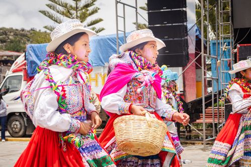 Free Young girls in traditional Peruvian dresses celebrating a cultural festival in Cabanaconde, Arequipa. Stock Photo