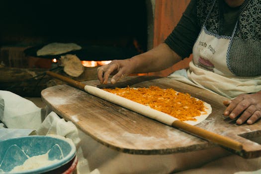 Authentic Turkish cooking with dough and ingredients in a cozy setting.