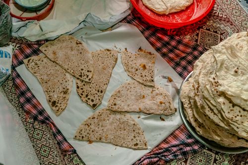 Free Delicious Turkish flatbread on a decorated table, showcasing authentic preparation and cultural heritage. Stock Photo