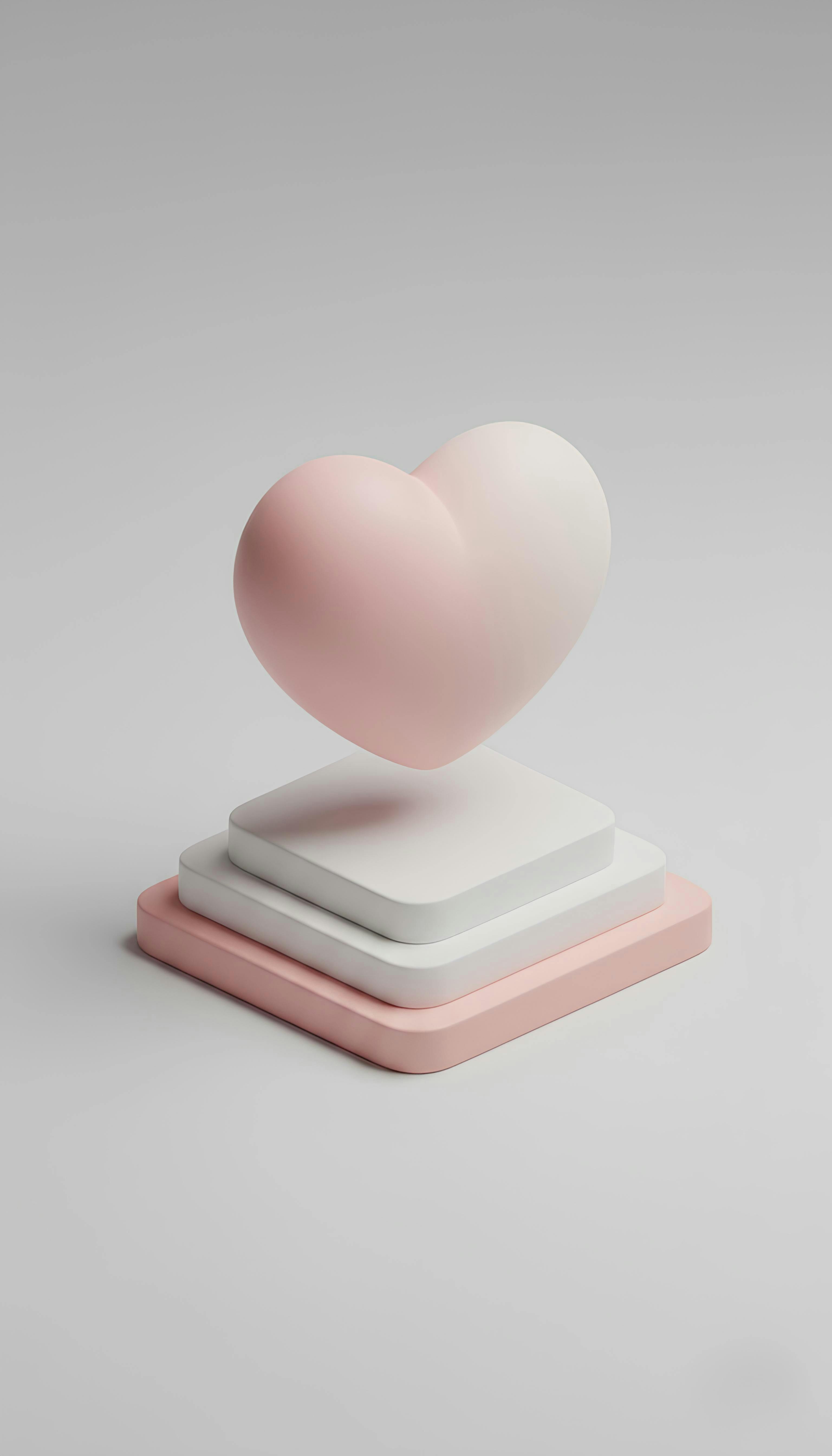 Gratis Minimalistisk lyserød og hvid hjerteskulptur på stablede piedestaler. Perfekt til Valentinsdagens dekoration. Lagerfoto