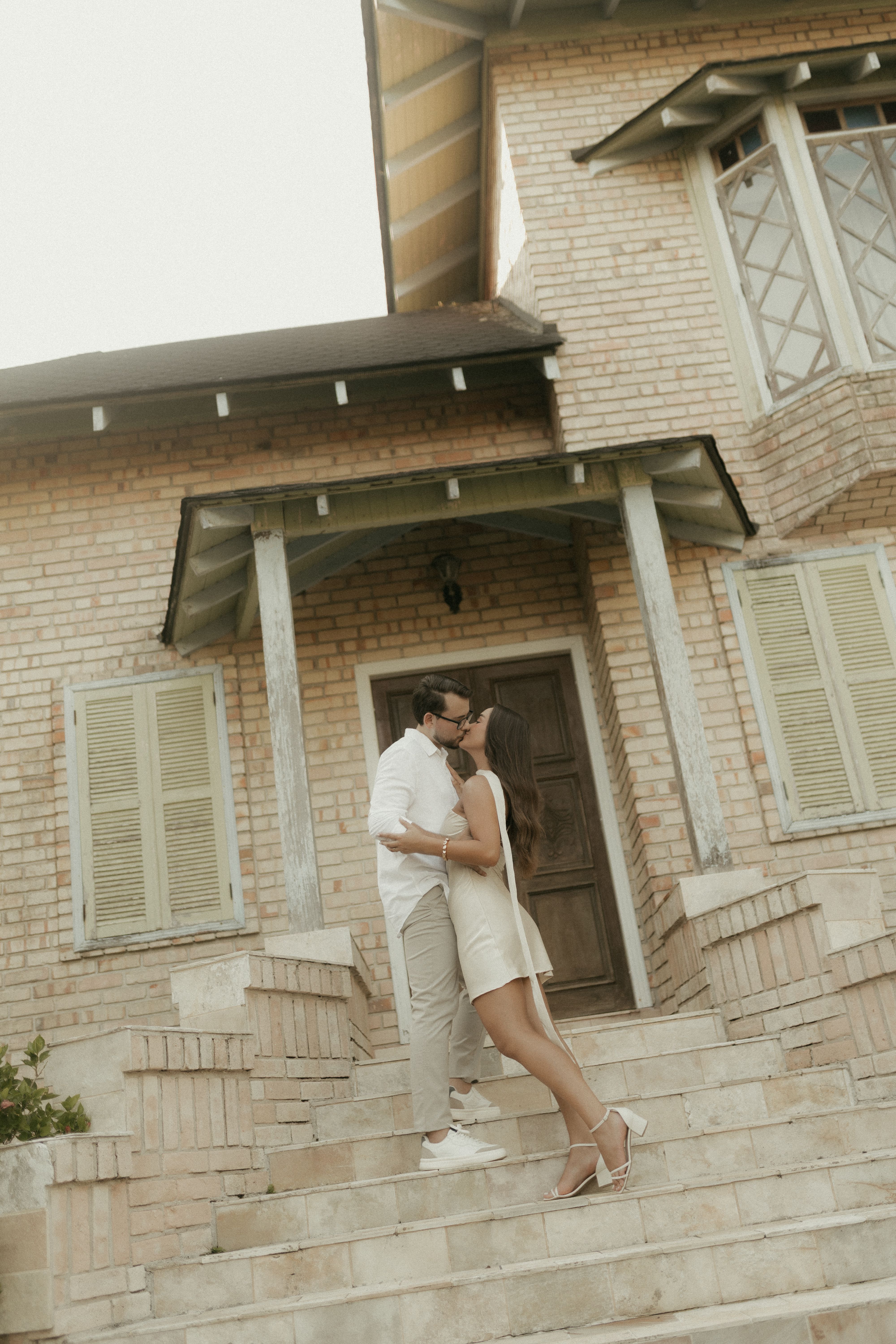 Romantic Couple Embracing on Rustic Steps · Free Stock Photo