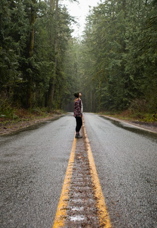 Free Person Standing on Road Stock Photo