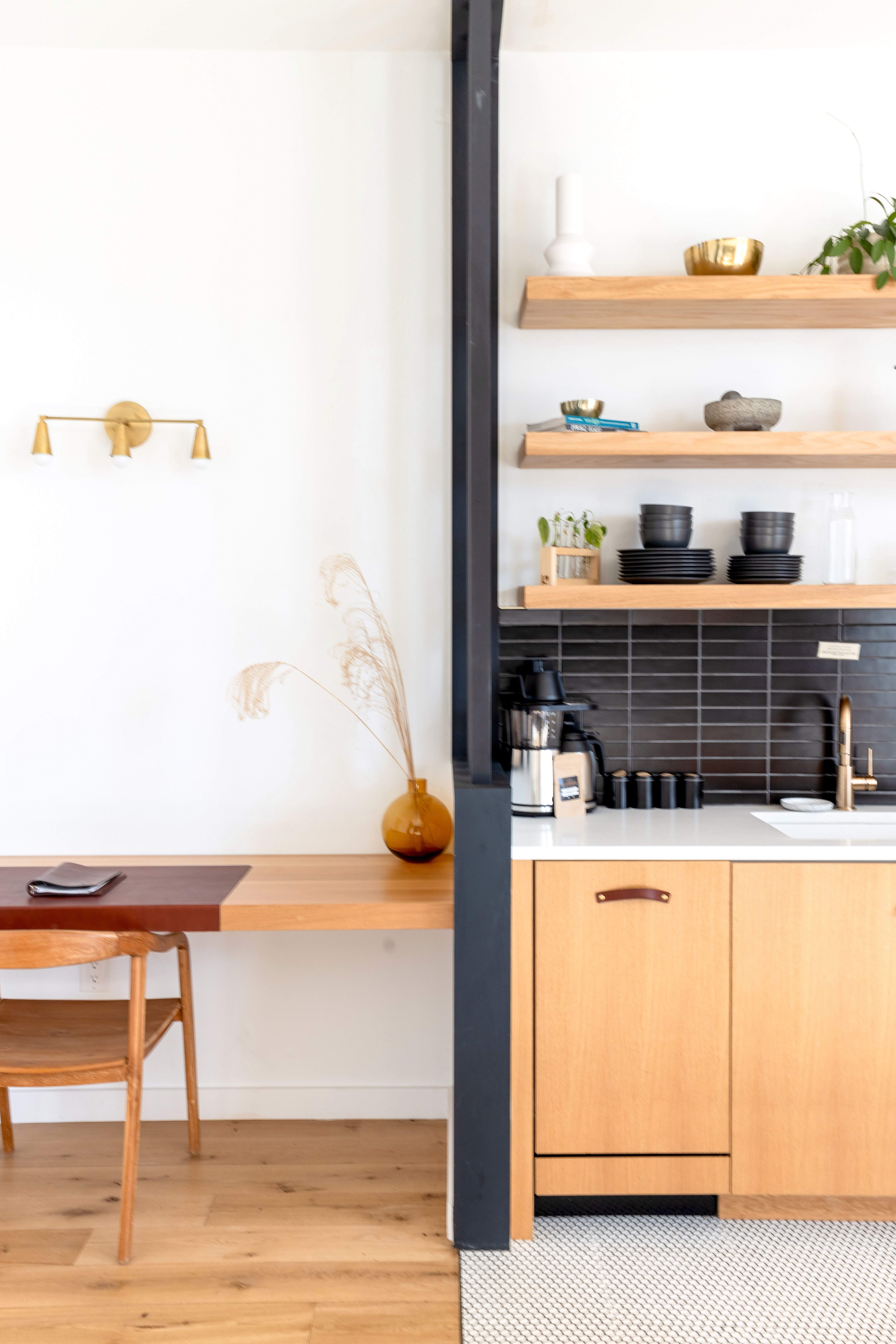 Warm wood open-plan kitchen connected to a comfortable apartment living area