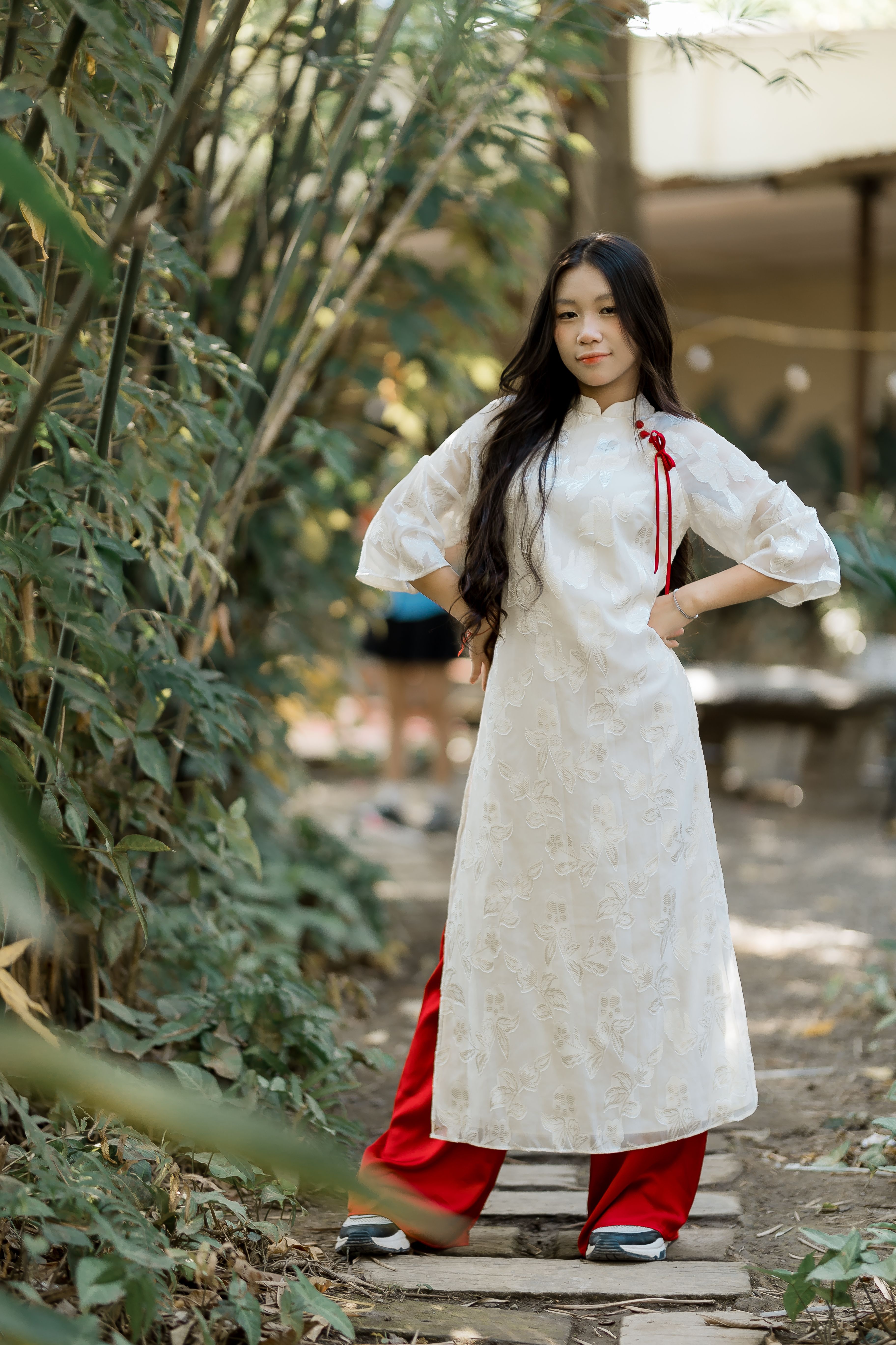 Young Woman in Traditional Vietnamese Dress Outdoors · Free Stock Photo