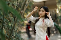 Young Woman in Traditional Asian Dress Outdoors