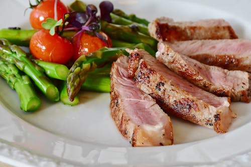 Free Grilled Meat Dish Served on White Plate Stock Photo