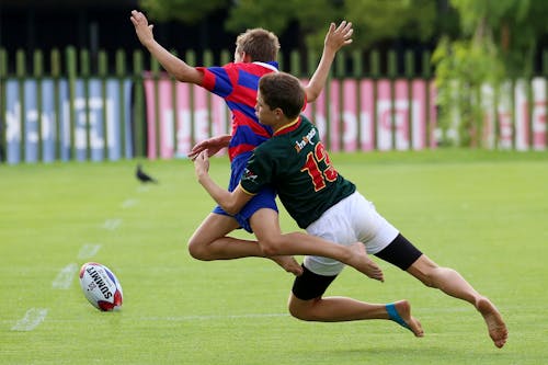 Foto Two Boys Playing Rubgy