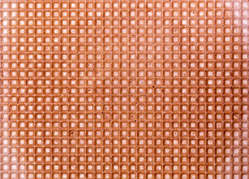 A detailed close-up shot of a waffle texture with a grid pattern, suitable for backgrounds.