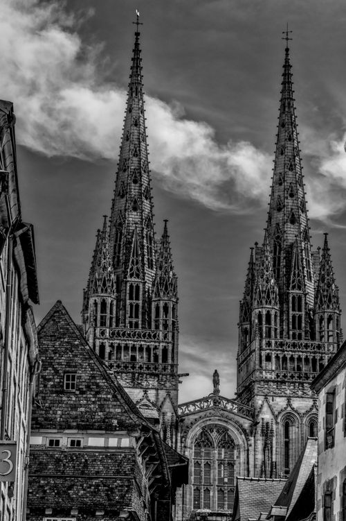 Free Dramatic black and white photograph of Saint-Corentin Cathedral in Quimper, France, showcasing gothic architecture. Stock Photo