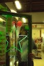 Woman at Convenience Store Fridge with Neon Light