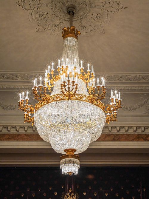 Free Grand crystal chandelier with ornate details in elegant indoor setting. Stock Photo