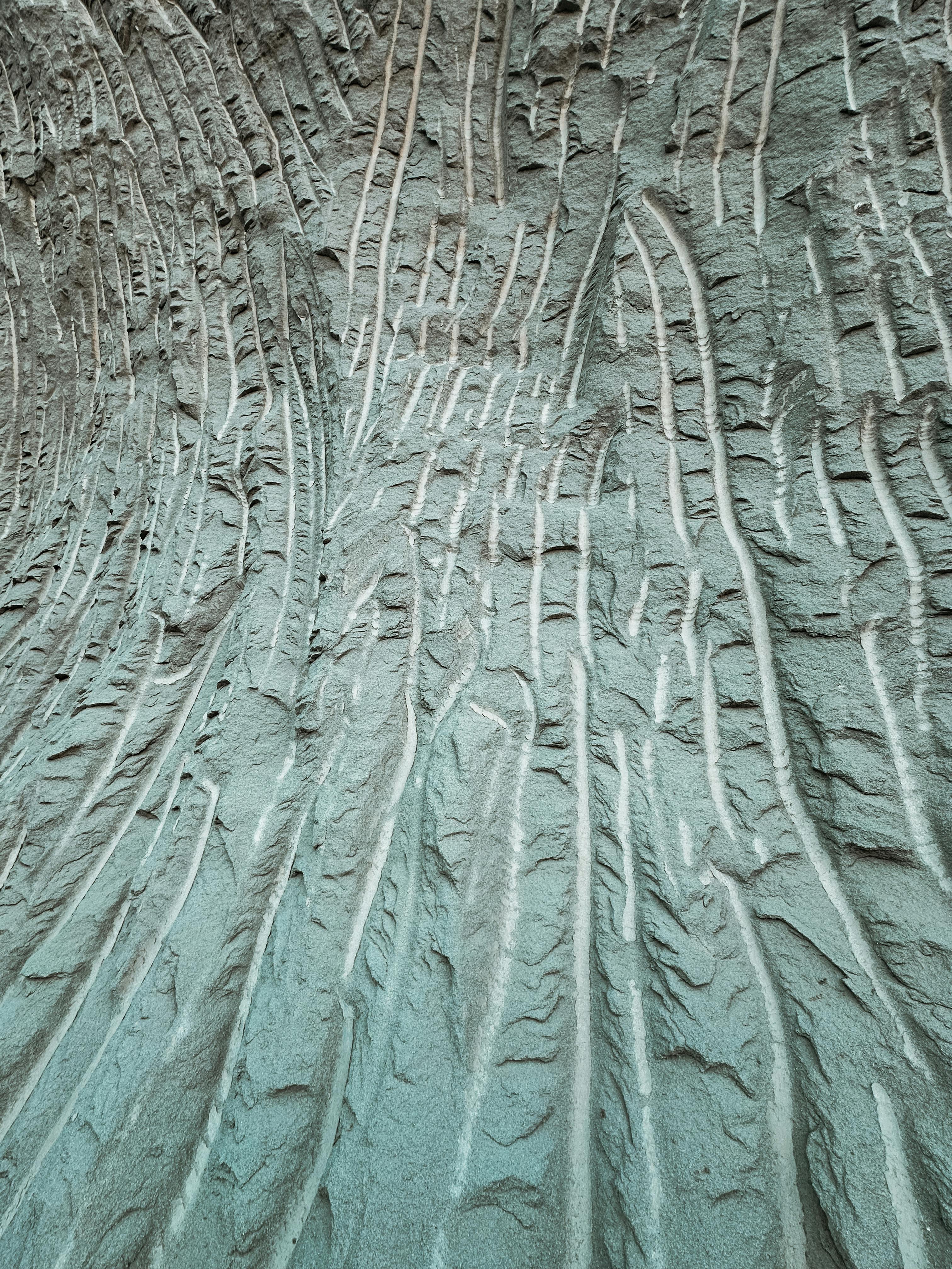 Kostenlos Nahaufnahme einer strukturierten Sandoberfläche mit natürlichen Wellenmustern und Linien. Stock-Foto