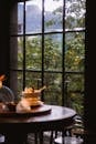 Cozy Restaurant Table with Lush Greenery View