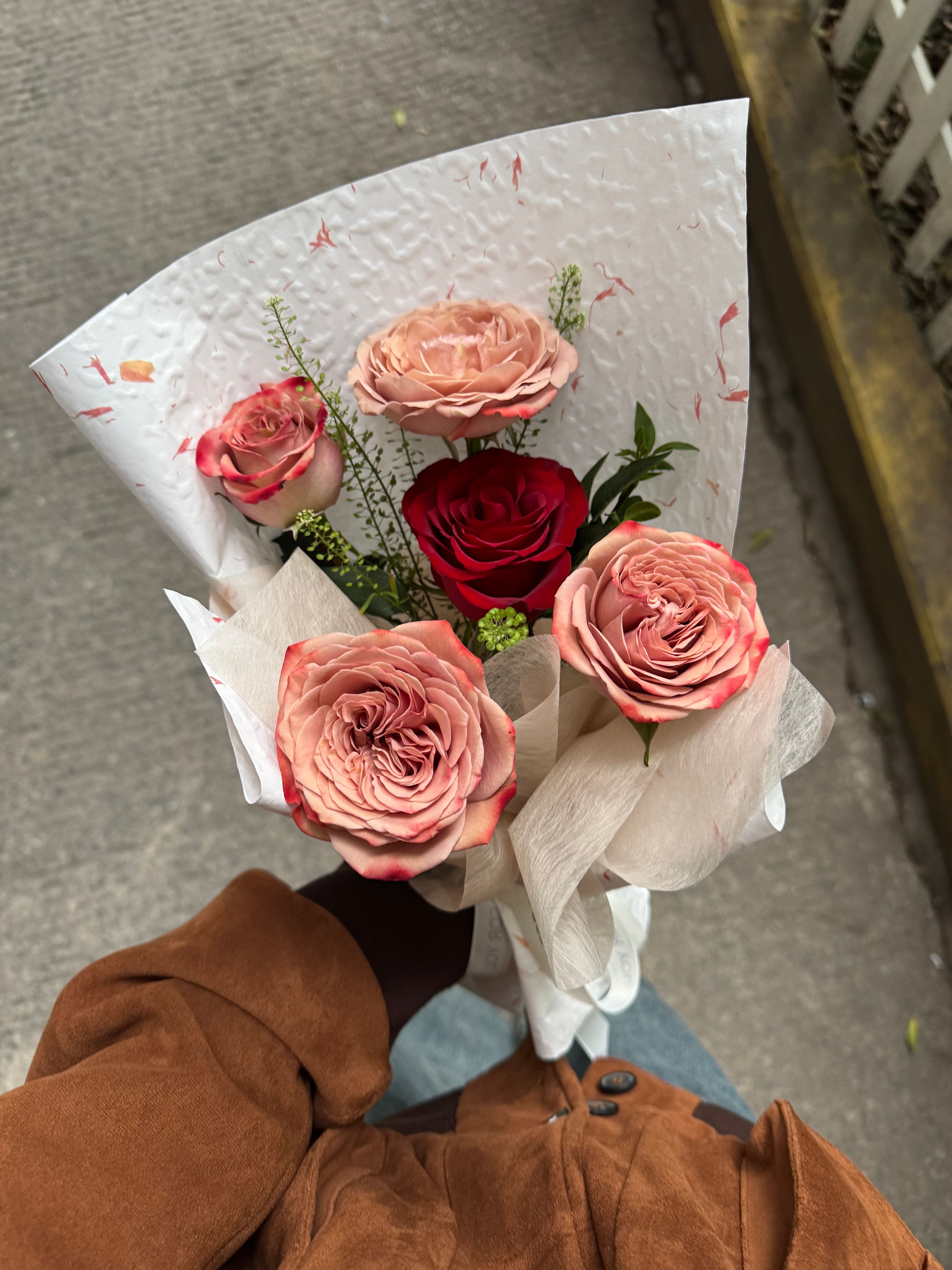 Elegant Bouquet of Roses in Tan Coat · Free Stock Photo