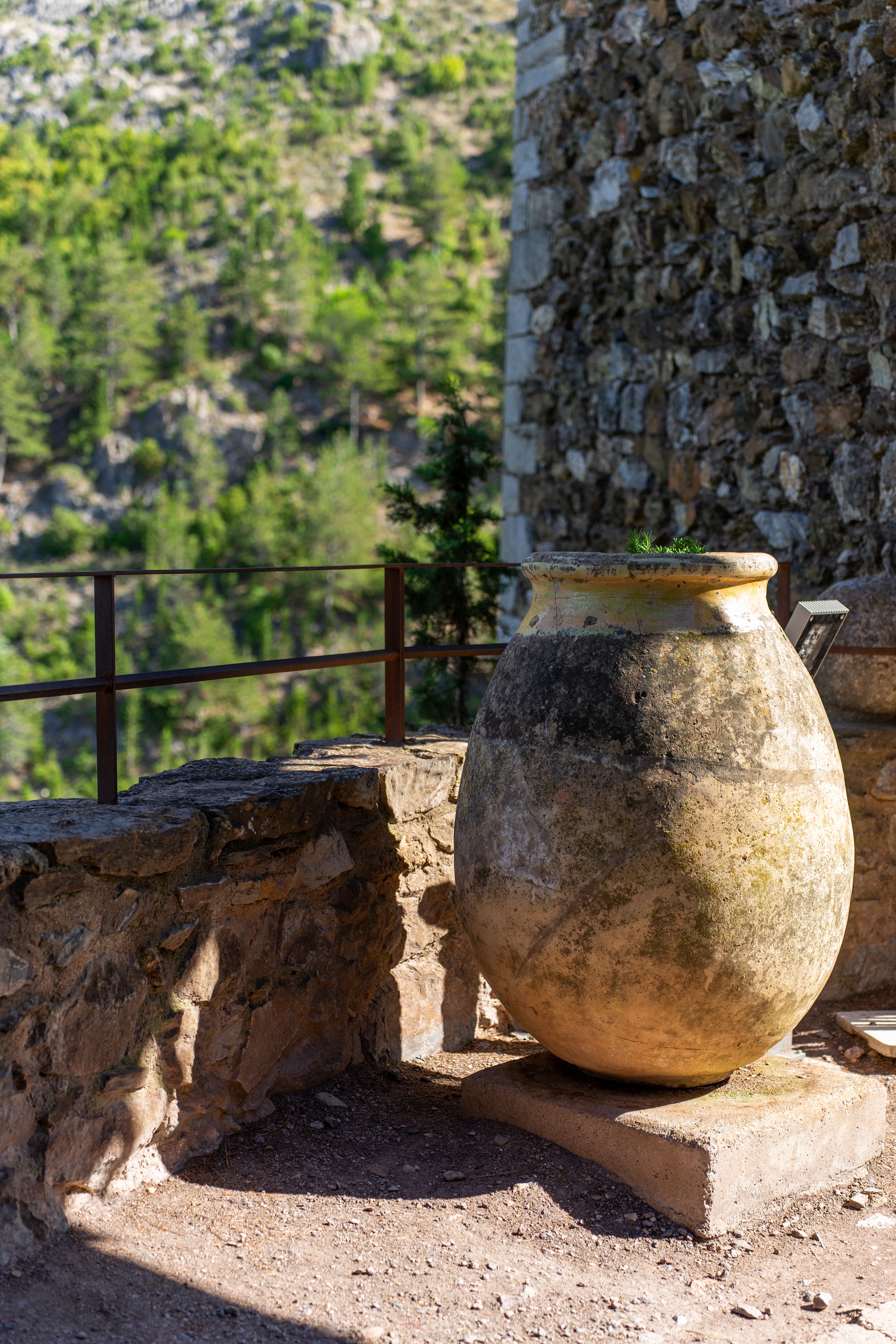 Rustic Stone Jug on Mediterranean Terrace · Free Stock Photo