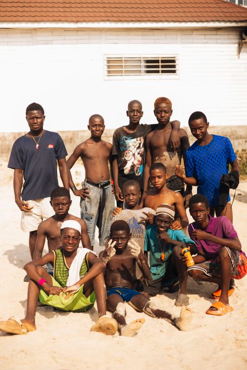 Free A lively group of boys enjoying a sunny day at the beach in Freetown, Sierra Leone. Stock Photo