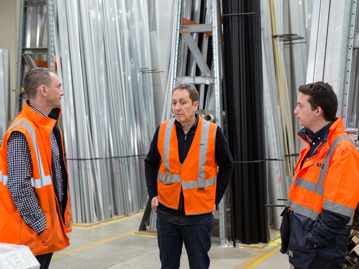 Workplace team discussing safety and readiness in an industrial setting