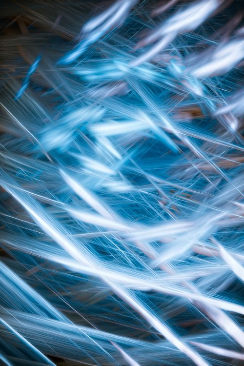 Free Abstract image of flowing blue and white light streaks creating dynamic patterns. Stock Photo