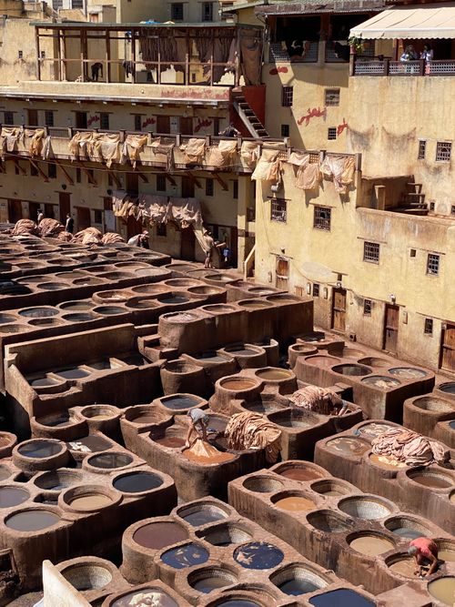 Free An aerial view of the historic leather tannery in Fez, Morocco, showcasing traditional dyeing vats. Stock Photo