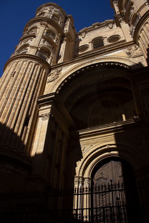 Free Explore the stunning Baroque details of the iconic Málaga Cathedral's facade under a clear blue sky. Stock Photo