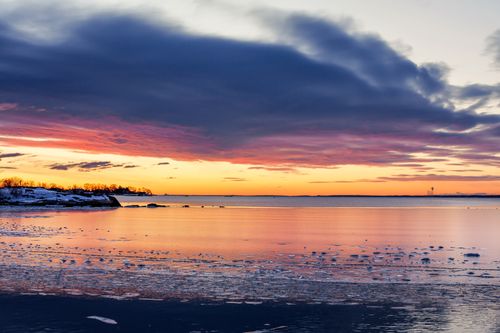 Free Beautiful sunrise over ice-covered waters at Stamford, Connecticut. Stunning winter colors. Stock Photo