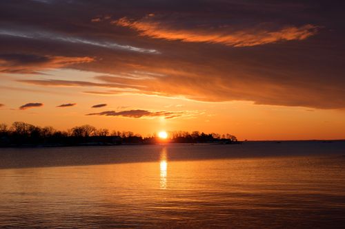 Free Beautiful winter sunrise over Cove Island Park, Stamford, Connecticut with vibrant hues reflecting on the water. Stock Photo