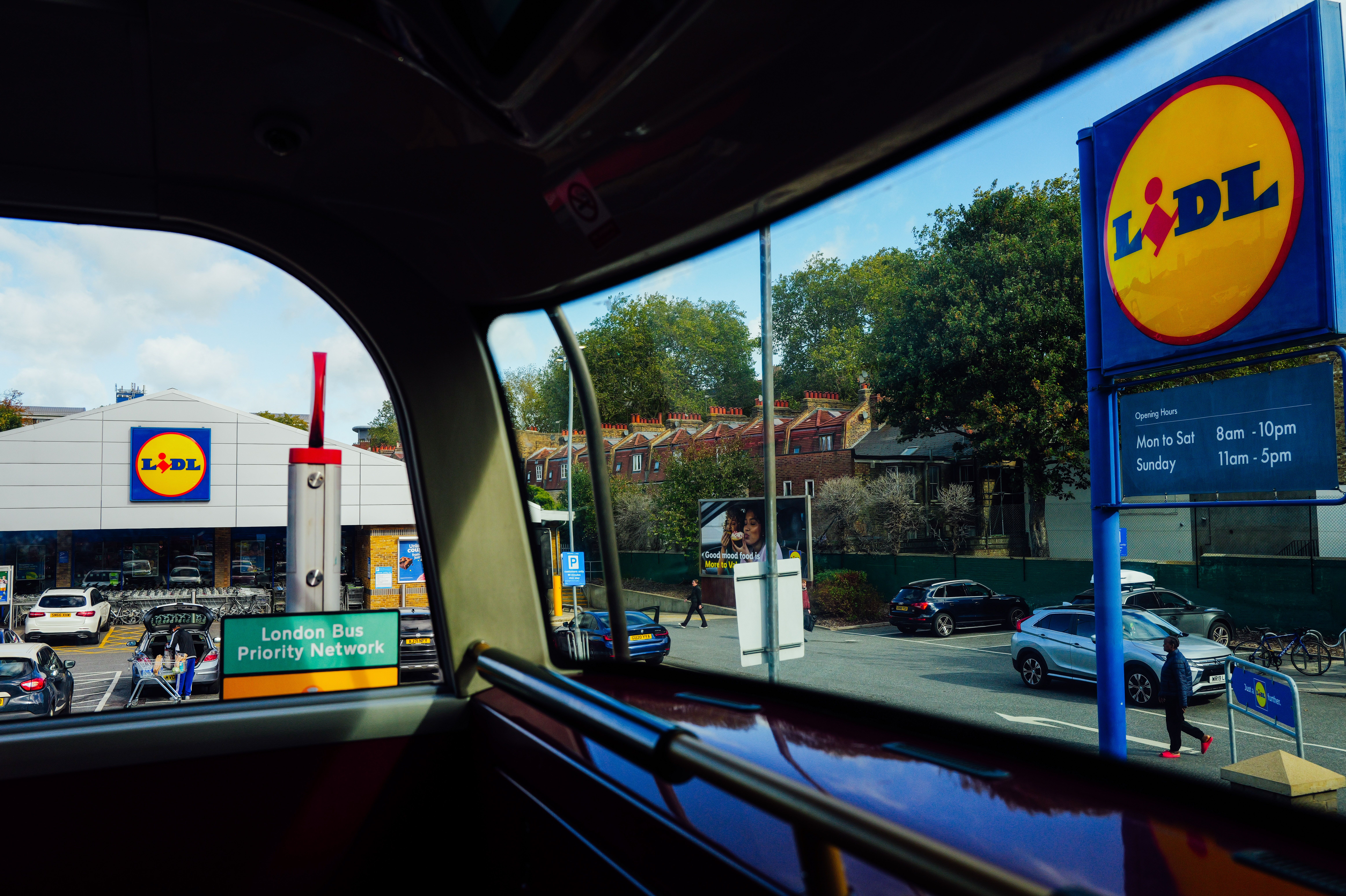 Outside view of a Lidl store from inside a London bus with clear signage.