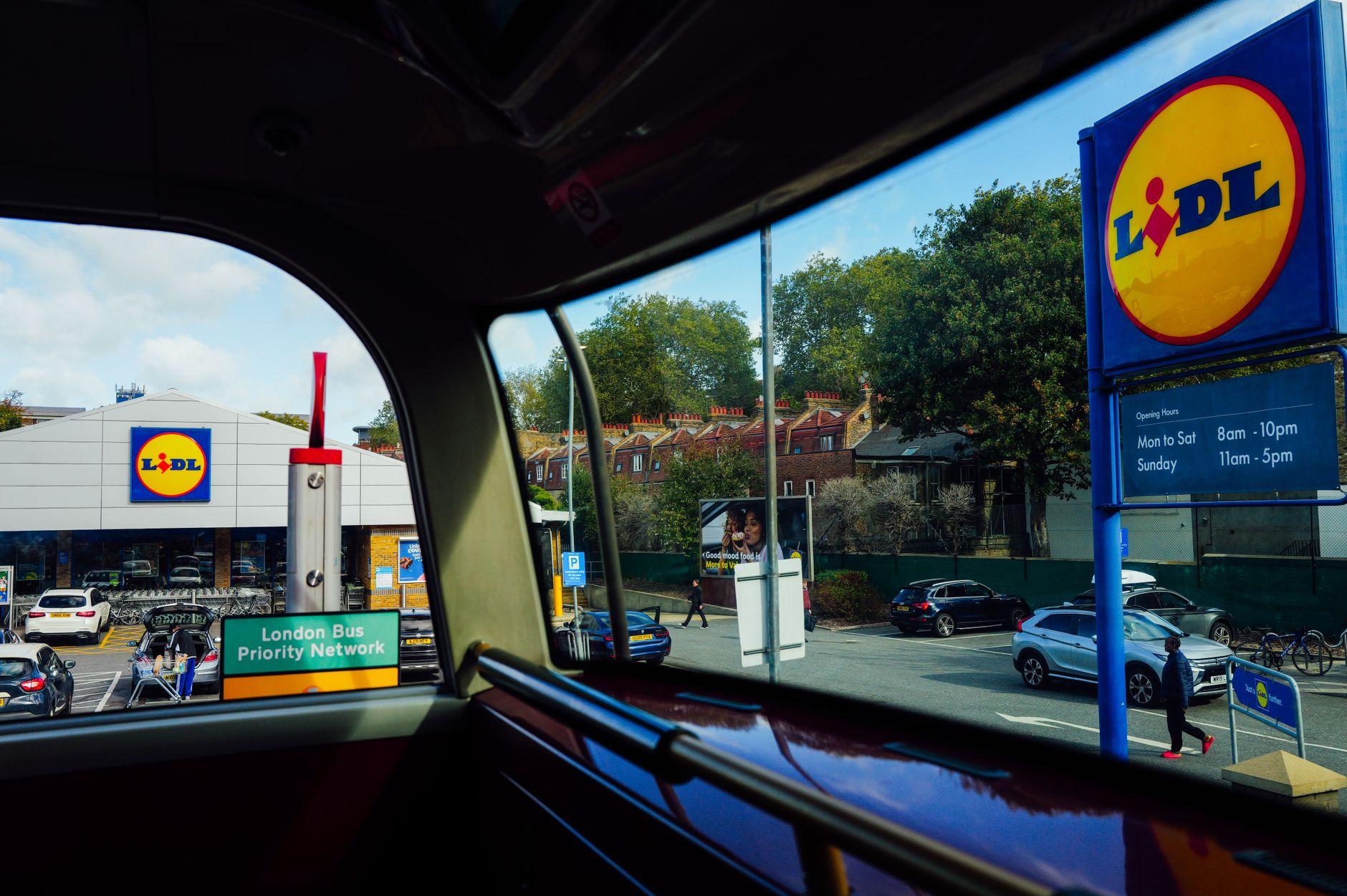 Outside view of a Lidl store from inside a London bus with clear signage.