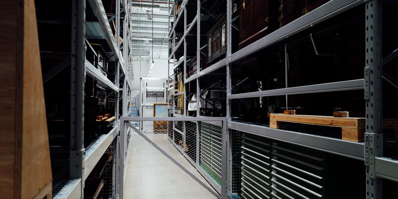 A detailed look at the interior of an industrial storage warehouse with metal shelves.