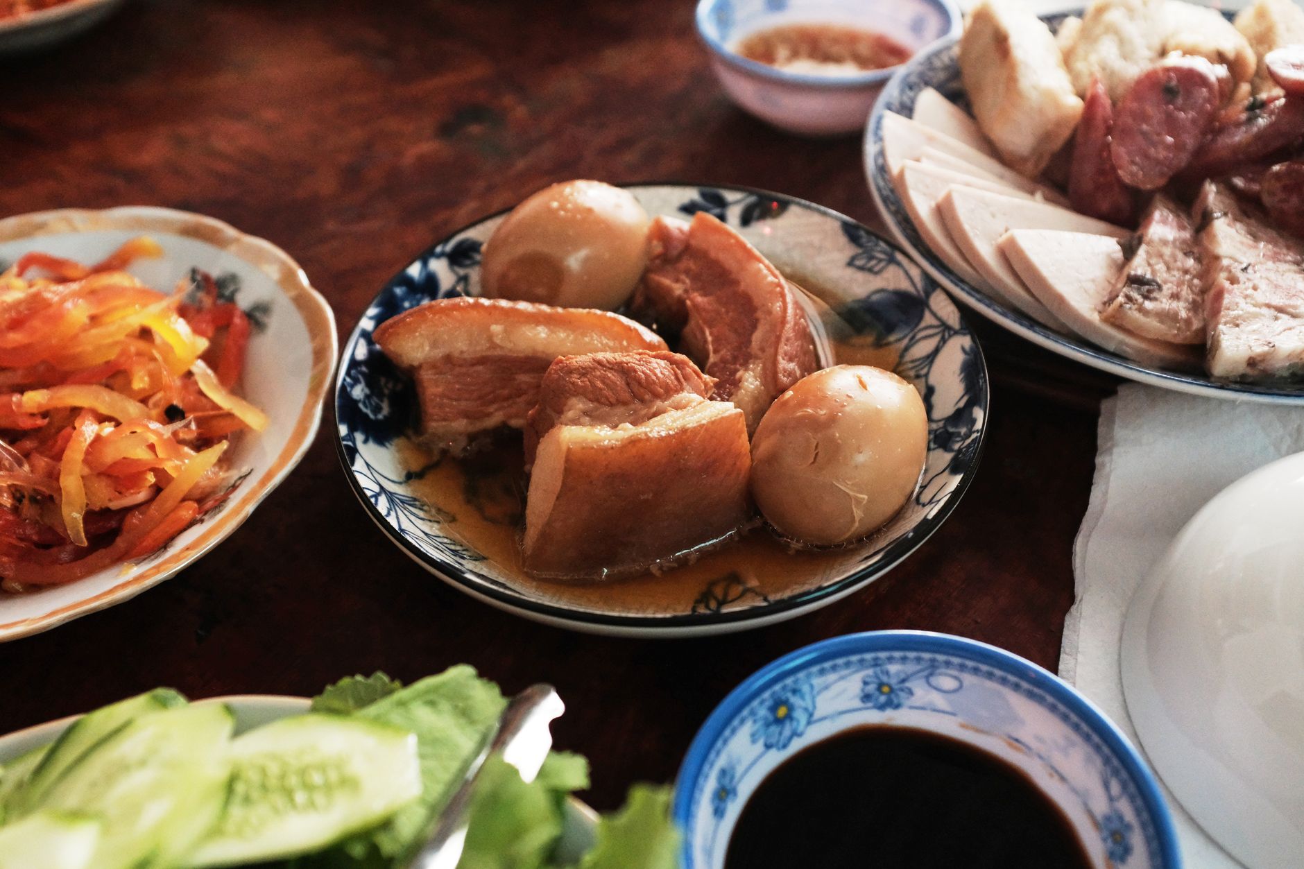 A colorful and authentic Vietnamese meal showcasing traditional dishes for Tet celebration in Ben Tre, Vietnam.