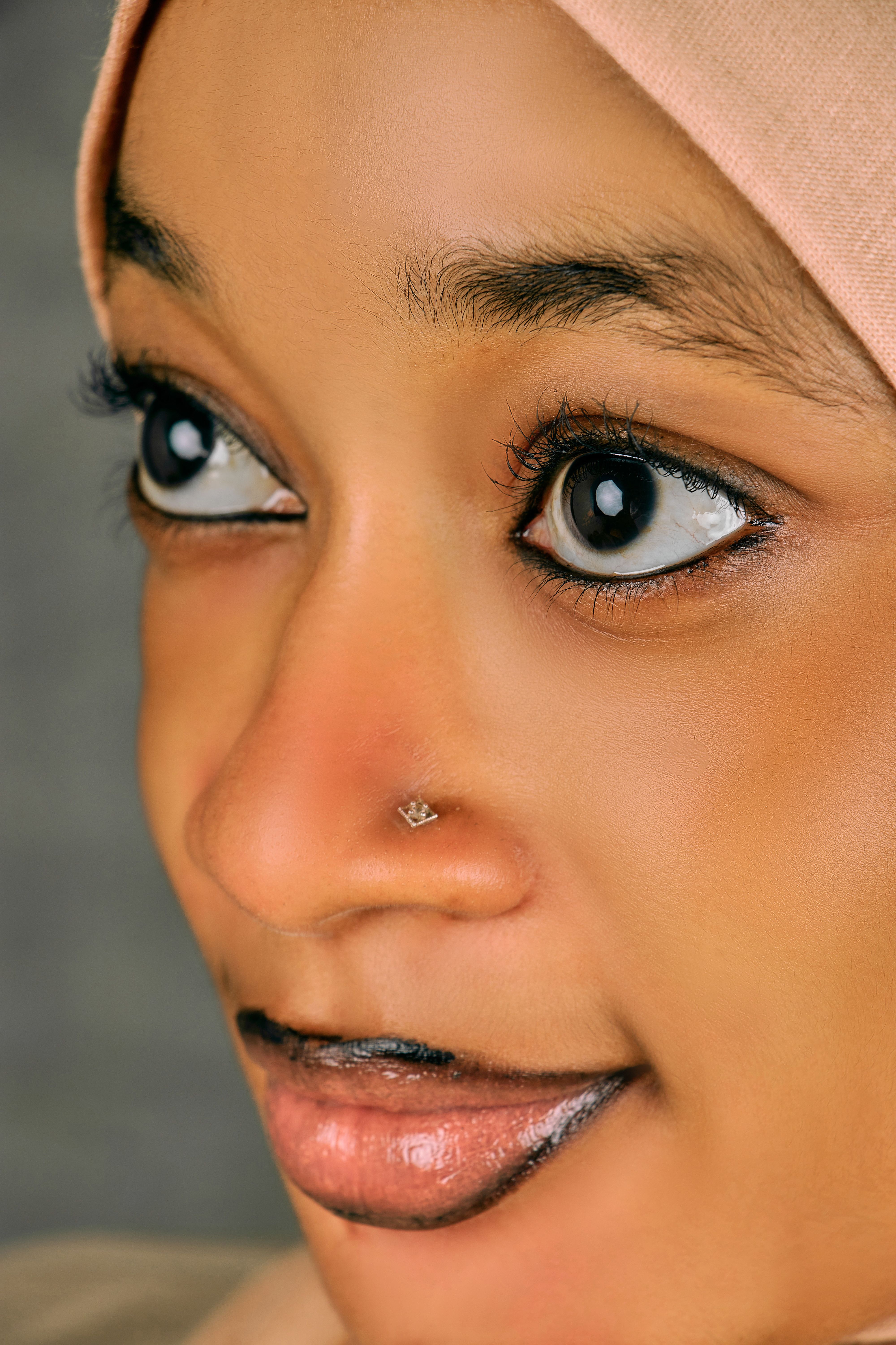 Close-up Portrait of a Thoughtful Woman in Hijab · Free Stock Photo