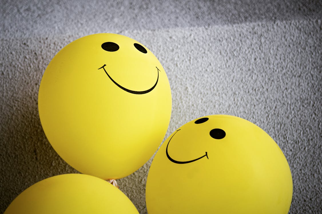 Free Yellow Smiley Emoji on Gray Surface Stock Photo
