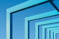 Abstract Blue Metal Frames Against Clear Sky