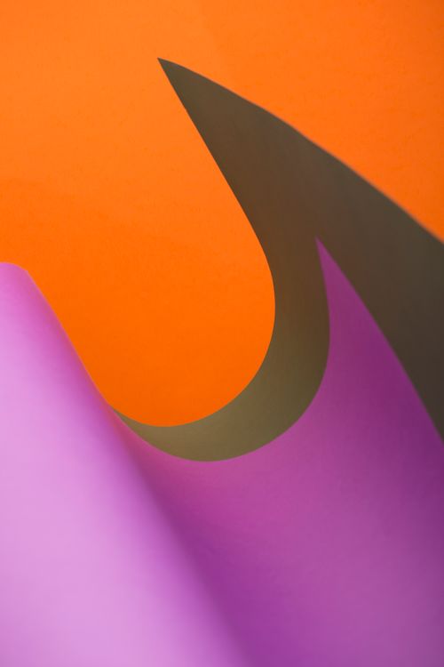 Free Vibrant abstract image showcasing colorful paper curves, ideal for creative backgrounds. Stock Photo