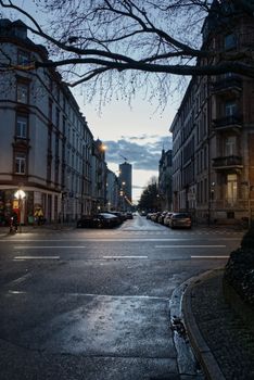 A serene evening street view in Frankfurt, capturing the peaceful ambiance against a twilight sky.