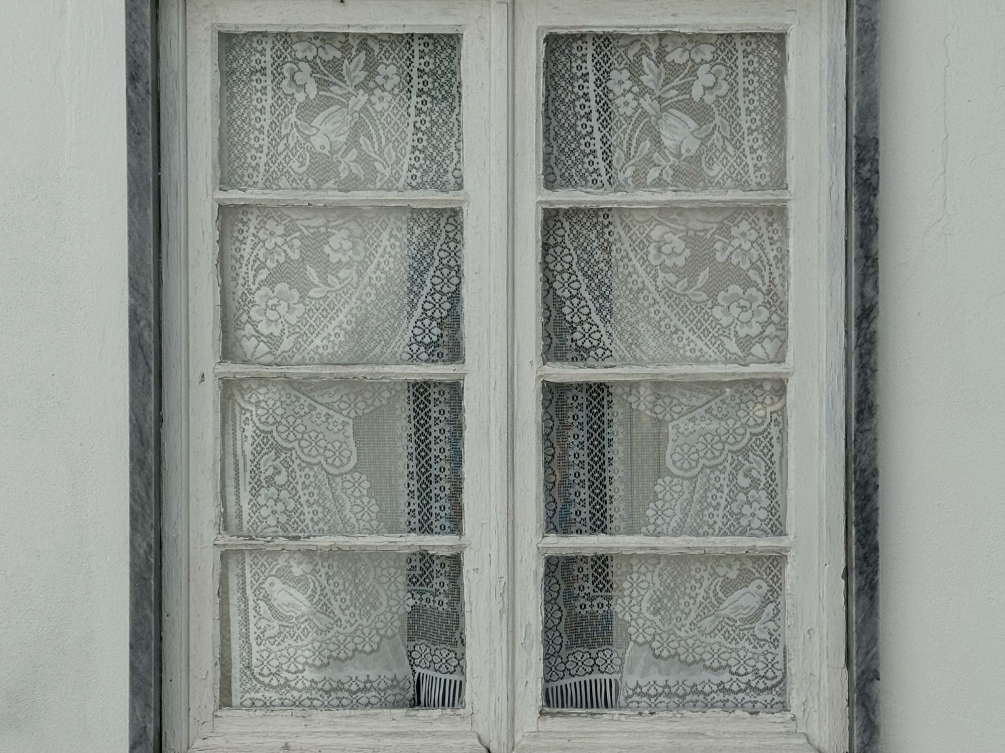 Dutch Lace Window Vintage Lace-Covered Window with Rustic Charm · Free Stock Photo