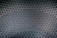 抽象六边形金属图案，表面带有纹理，非常适合设计和技术背景