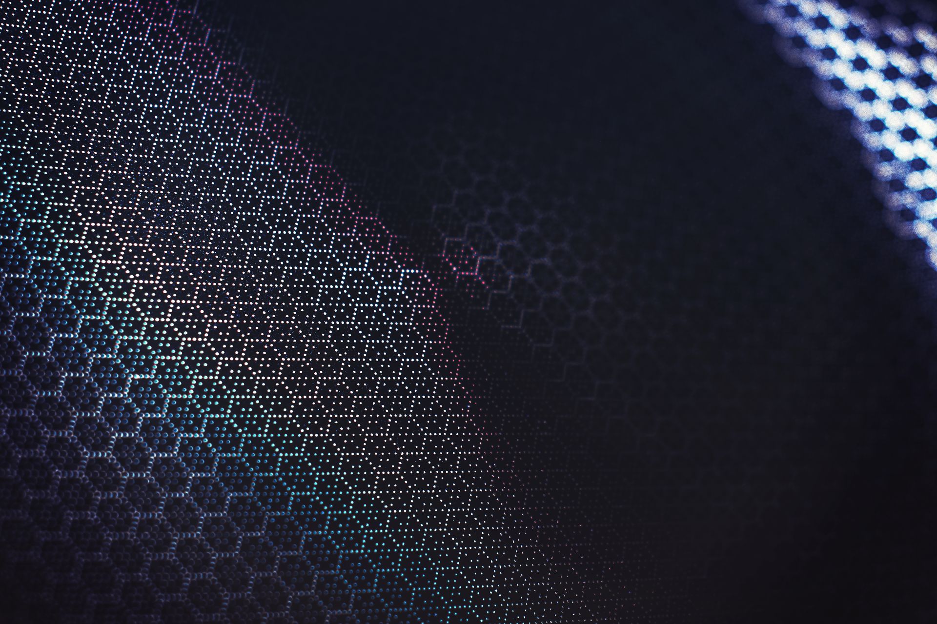 Futuristic abstract design with a dark geometric hexagonal pattern and creative color gradients.