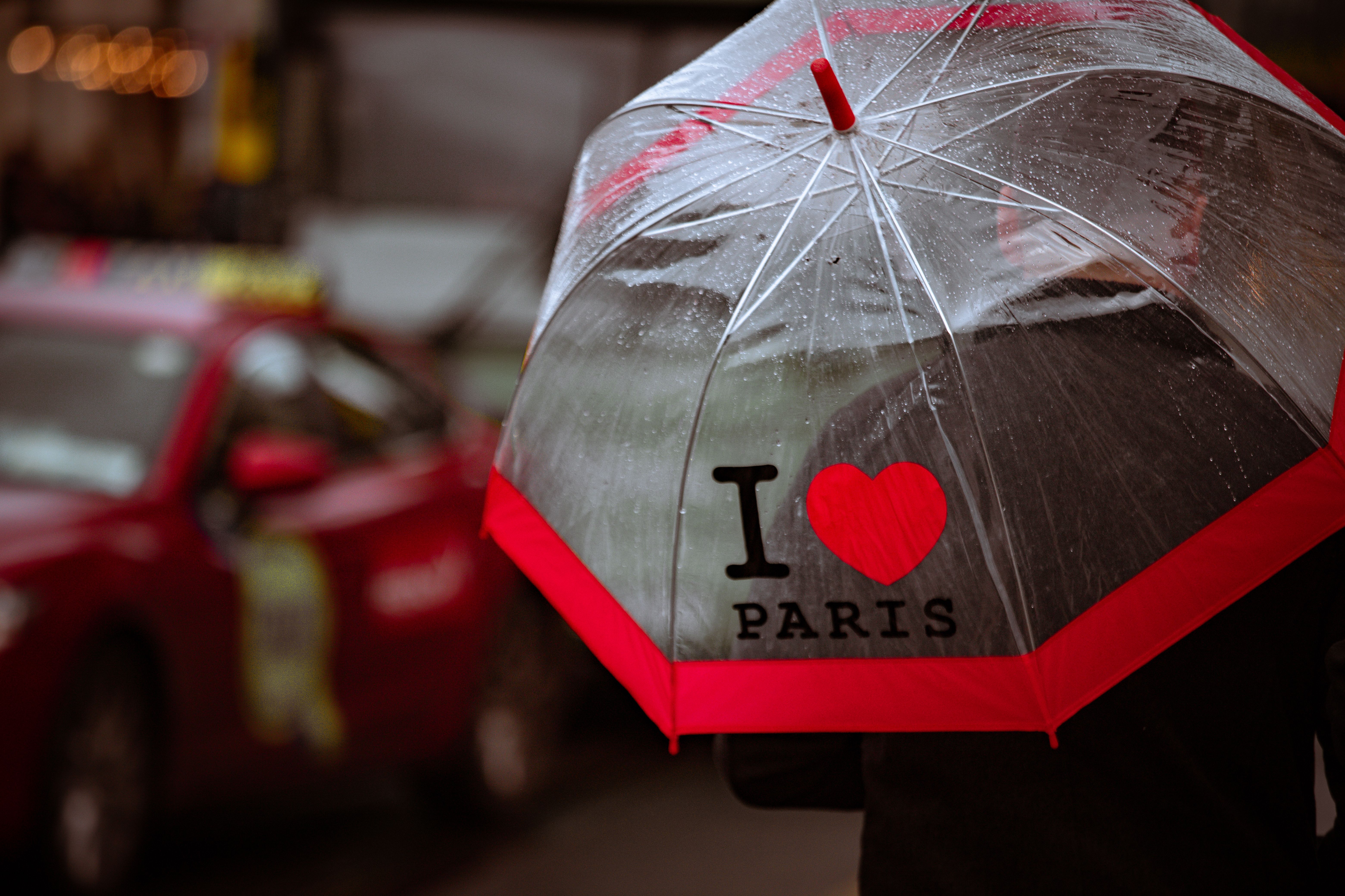 Rainy Day Street Scene with Paris Umbrella · Free Stock Photo