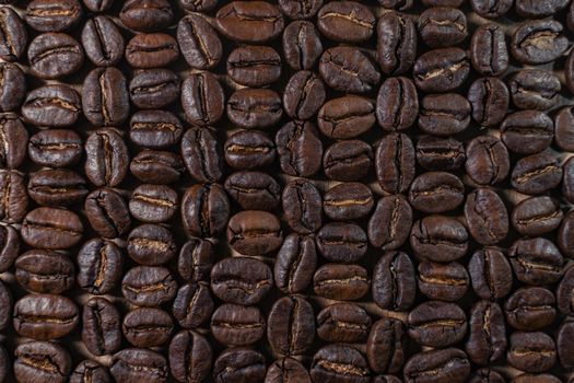 High-quality close-up image of roasted coffee beans, highlighting rich textures and earthy tones.
