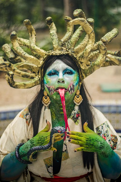Free Striking image of a Medusa-inspired character with artistic makeup in Mexico City, blending fantasy and culture. Stock Photo