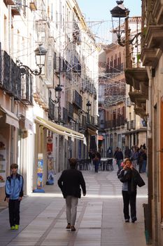 A bustling day on a historic street in Ávila, Castile and León, Spain.