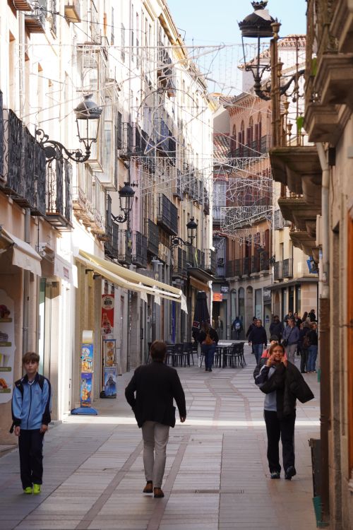 Free A bustling day on a historic street in Ávila, Castile and León, Spain. Stock Photo