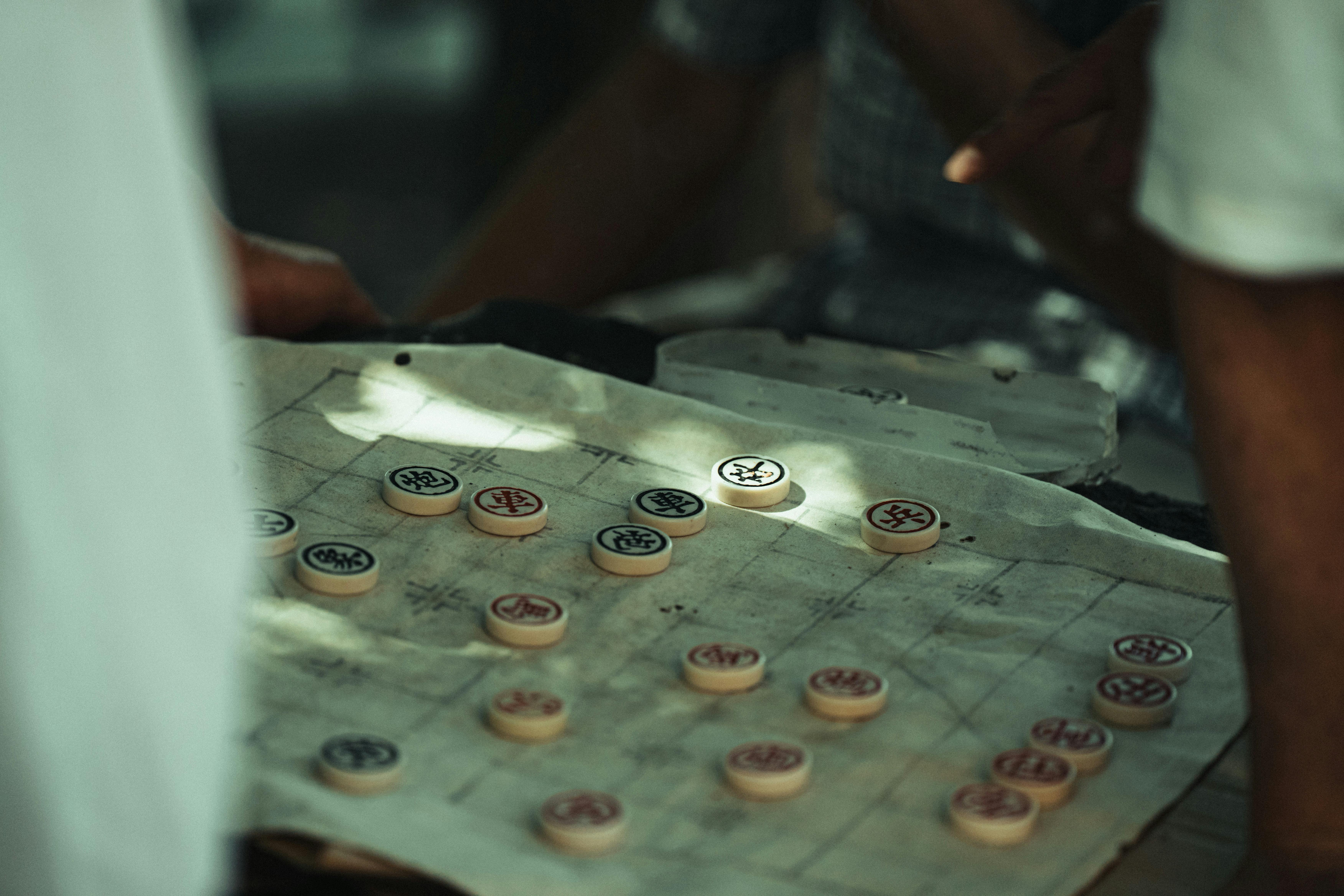 Free Close-up of a traditional Chinese board game being played outdoors in NYC. Stock Photo