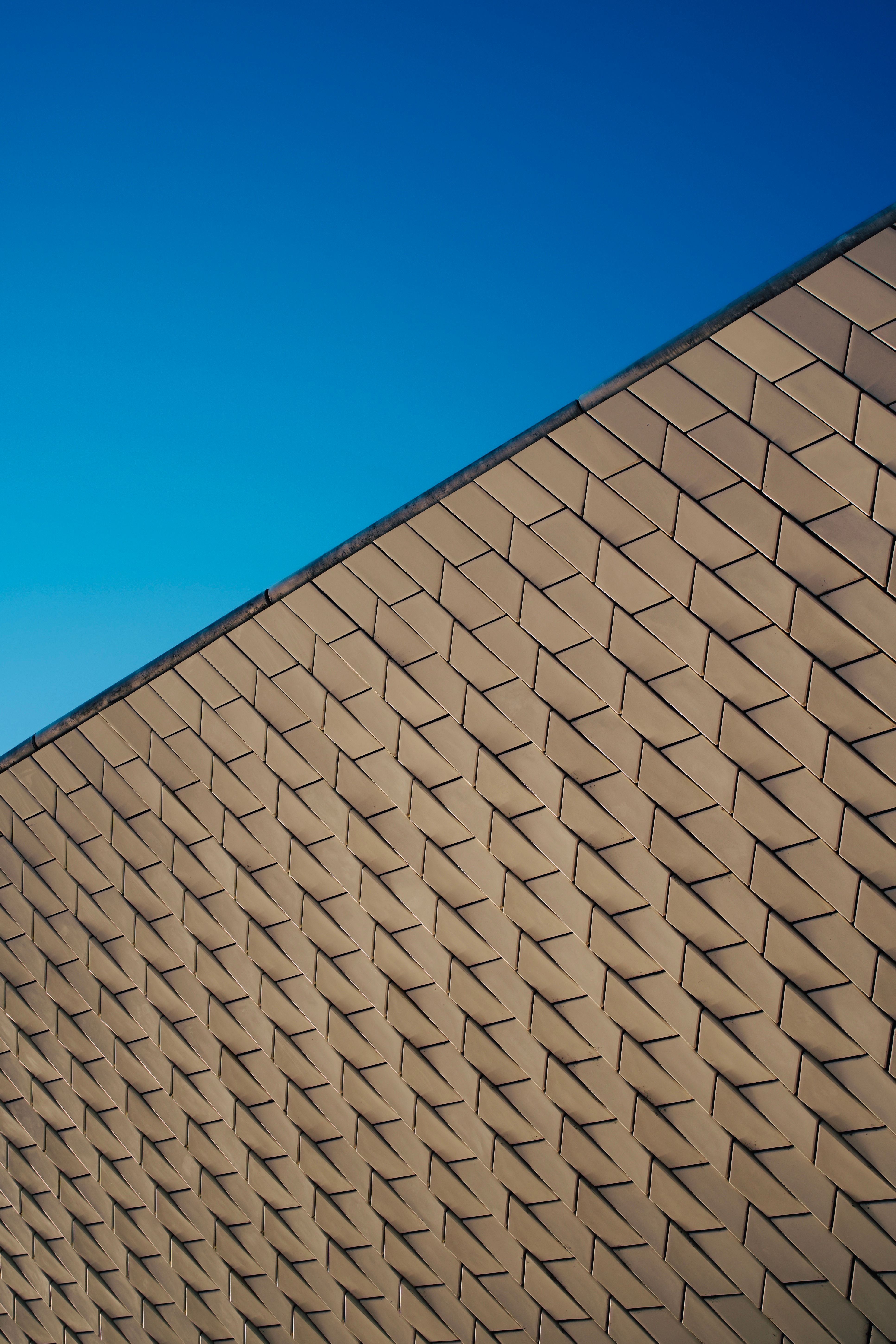 Modern Architectural Facade with Geometric Patterns · Free Stock Photo