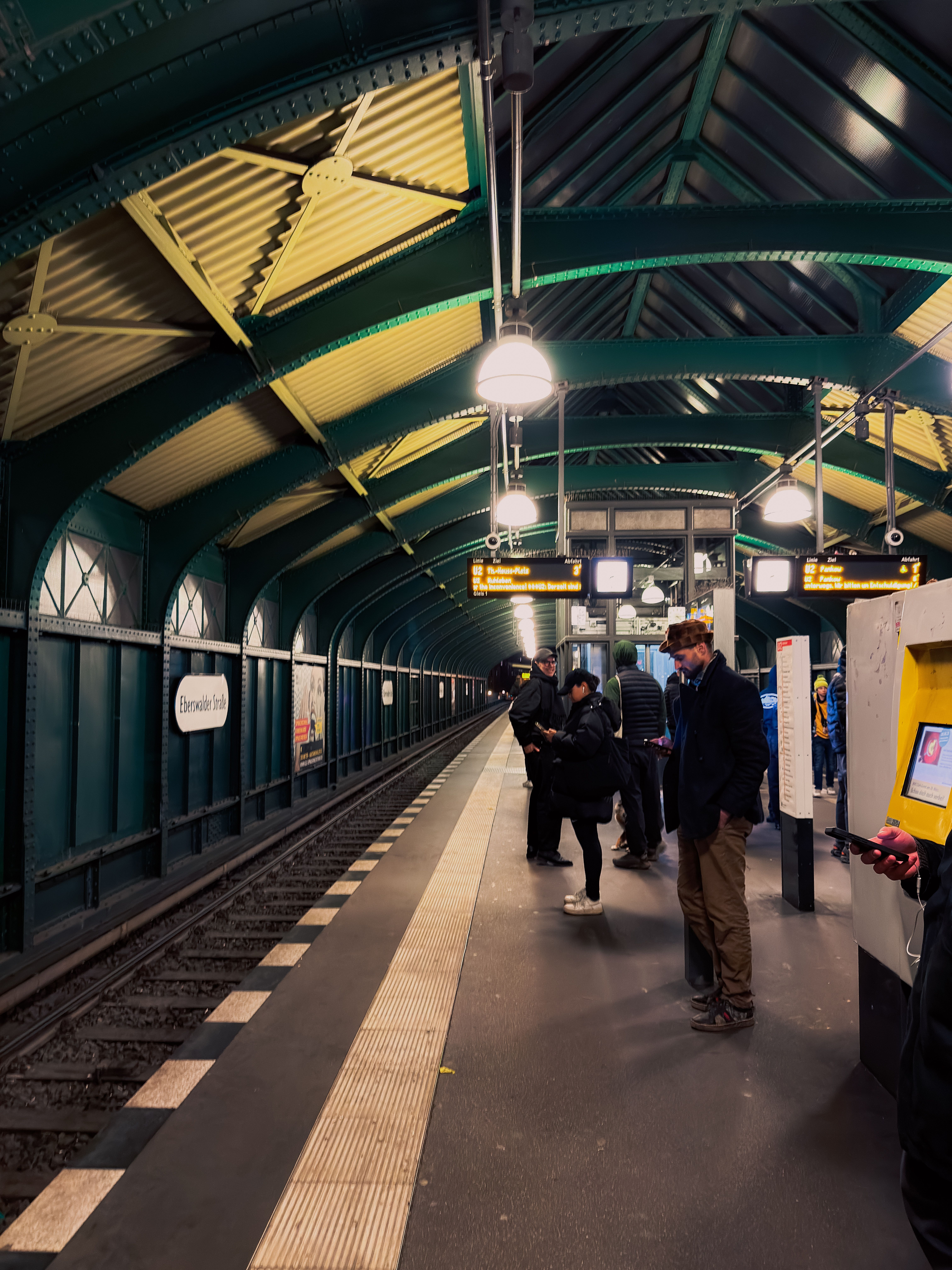 Commuters Waiting at Urban Train Station · Free Stock Photo